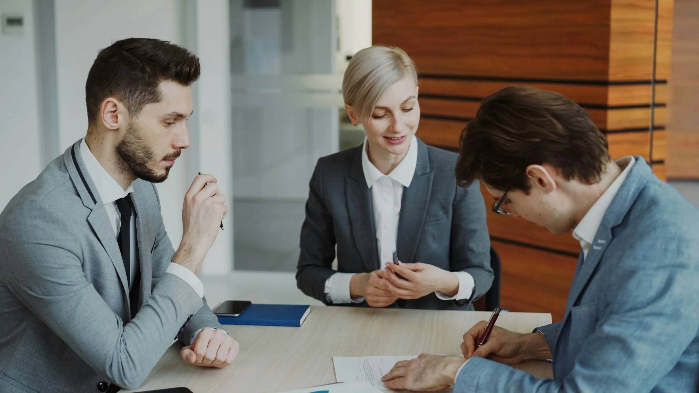 Business leaders reviewing employment documentation